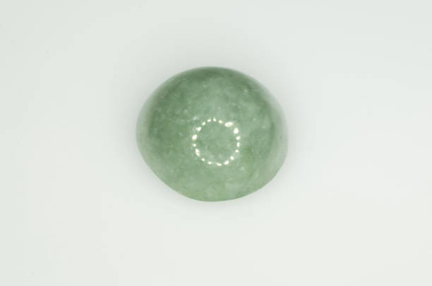 istock Natural green jadeite on the white background 1336457989