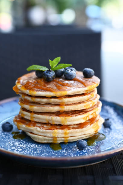 istock delicious blueberry pancakes with syrup in a restaurant 1336458238