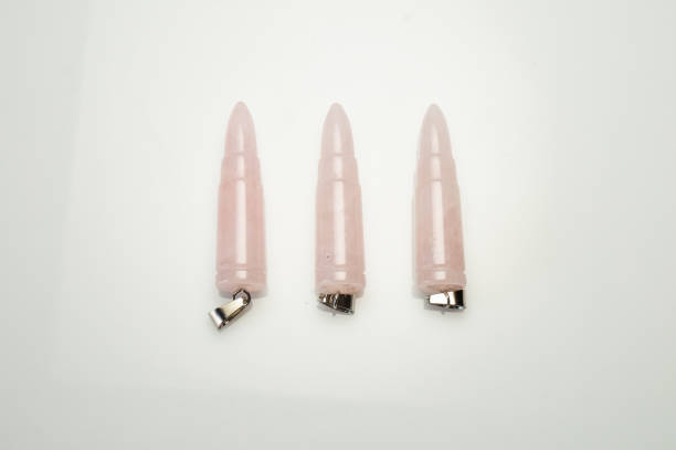istock Natural rose quartz cartridge pendant on the white background 1336458263