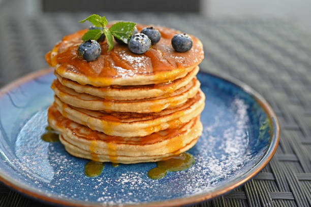 istock delicious blueberry pancakes with syrup in a restaurant 1336459136