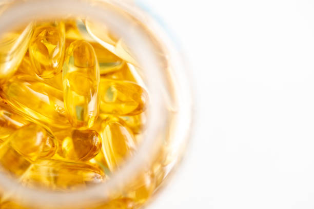 Fish oil Omega 3 abstract yellow background