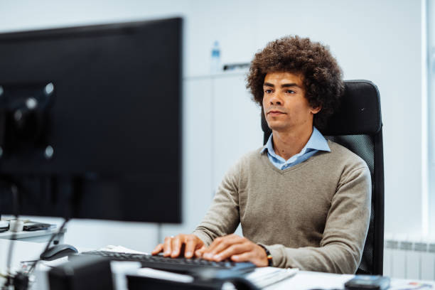 istock Mixed race employee working in office 1336462315