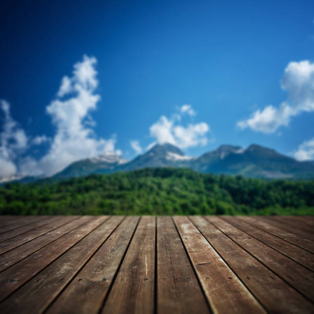 istock Wooden floor and defocused mountain landscape on background 1336462496
