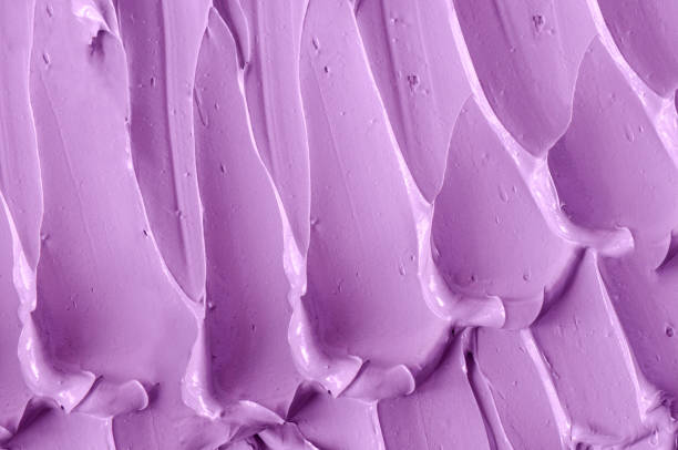 istock Purple clay (alginate face mask, body wrap, hair shampoo, conditioner) texture close up, selective focus. Abstract lavender background with brush storkes. 1336463352