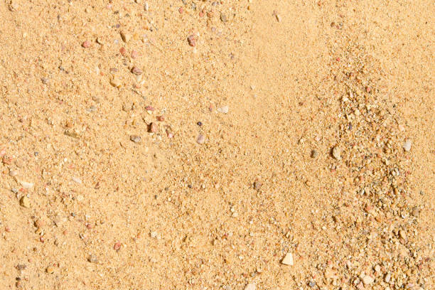 istock River rocky sand in sunny day macro closeup sandy background for concrete mix in construction industry. 1336463565