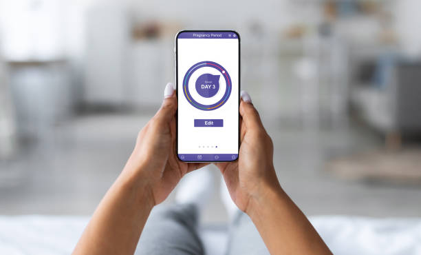 istock Young pregnant woman using mobile application for pregnancy 1336464506