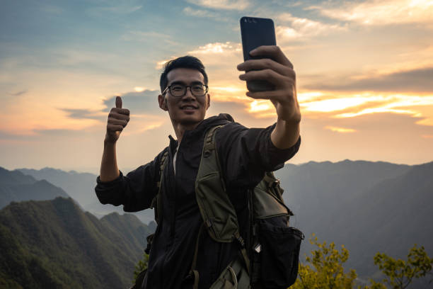 istock Hiker taking a selfie with smart phone 1336464612