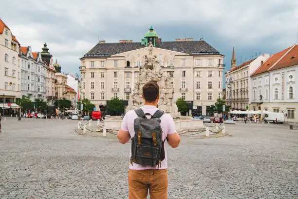 traveler man at tourist square at old european city. brno czech republic