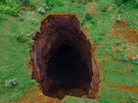 overhead view of collapsed mine big hole in land