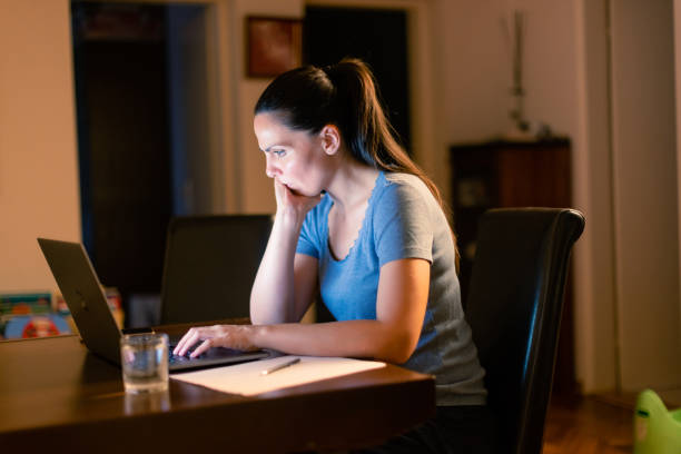 istock Woman working late night at home 1336465097