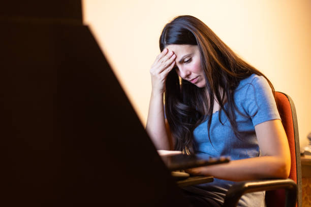 istock Woman working late night at home 1336465107