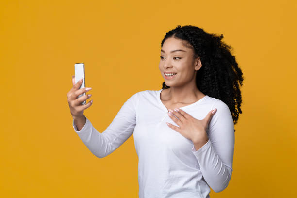 istock Mobile Offer. Cheerful Black Female Looking At Smartphone Screen With Excitement 1336466115