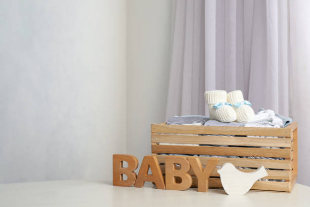 istock Composition with child's clothes on white table indoors, space for text 1336466393