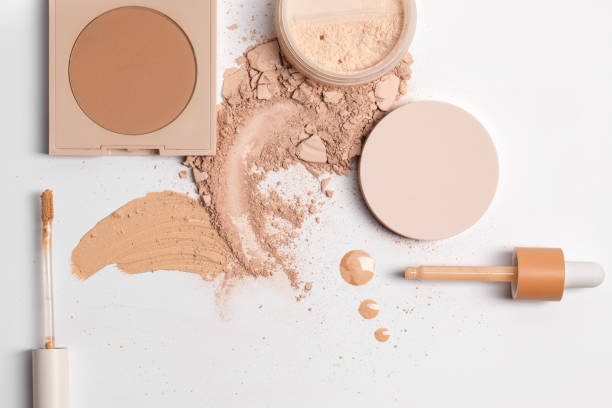 istock Set with Crashed beige face finishing, bronzing and liquid serum powder and tools isolated on white background 1336467315