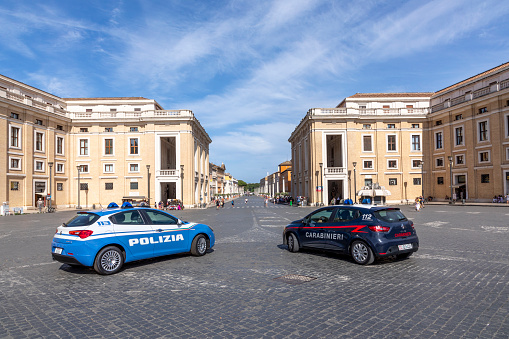 Rome, Italy - August 2, 2021: police pays attention at  St. Peter's square in the Vatican. Due to Corona there are just a view travelers visiting the Vatican.
