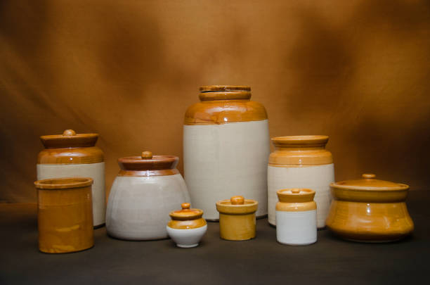 Variety of traditional ceramic jars on Brown background