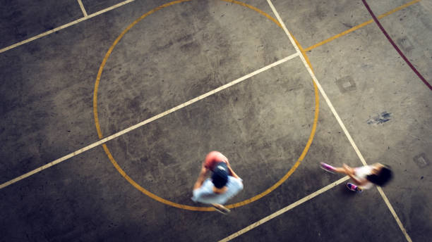 istock Father and daughter playing basketball 1336469090