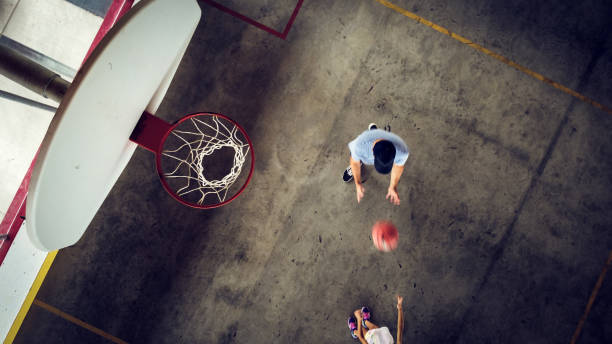 istock Father and daughter playing basketball 1336469126