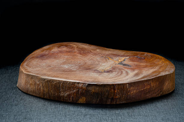 Rustic wooden board on a black table and black infinity background
