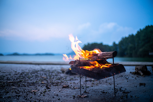 Burning campfire on the beach on mycamping trip