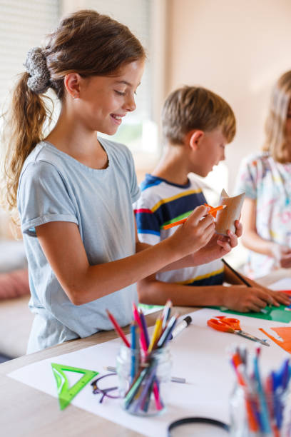 istock Girl using toilet paper roll to making a toy 1336470353