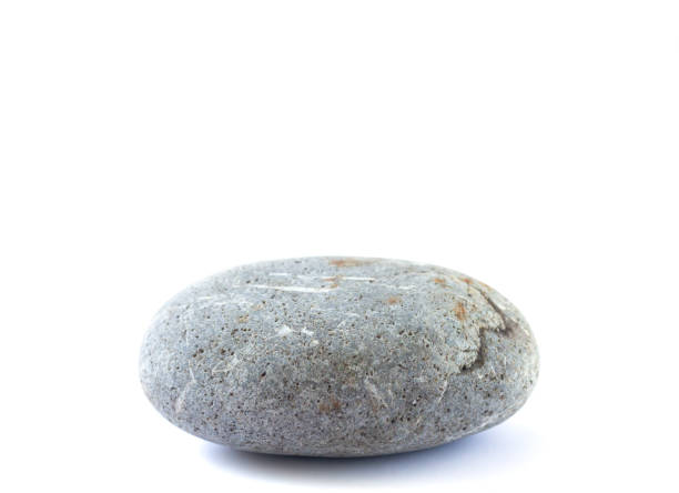 Stone podium or platform for cosmetic products or other object. Pebble isolated on white background
