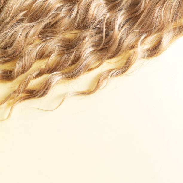 istock Texture blond wavy hair cut styling care or extension concept 1336471238