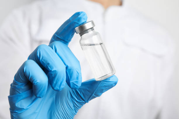 istock Doctor holding vial with medication, closeup. Vaccination and immunization 1336471639