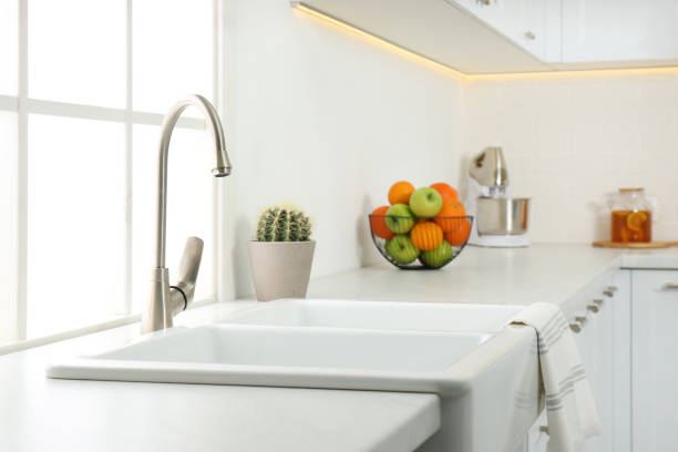 istock Ceramic sink and modern tap in stylish kitchen interior 1336472980