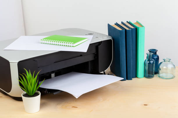 istock Office printer close up on a wooden table 1336473127