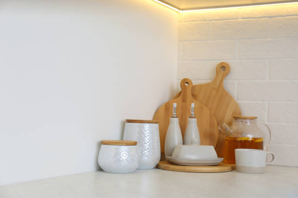 istock Wooden boards and different kitchen items on countertop indoors 1336473293
