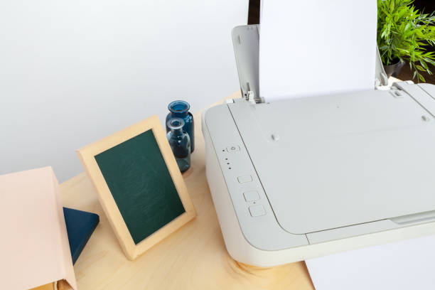 istock Hands of a woman using a copying machine close up 1336473873