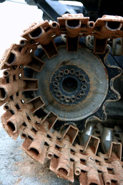istock Caterpillars steel wheels from a snowblower 1336478433