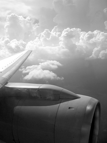 airplane reactor sky view from aircraft black and white