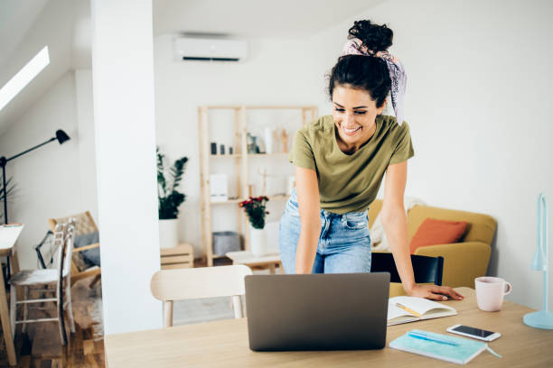 istock Happy young woman working online and enjoying 1336481359