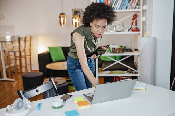 istock Female entrepreneur works from home 1336482096