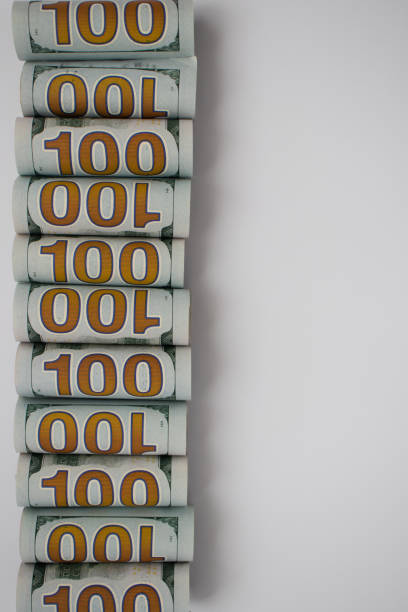 istock Rolled 100 dollars on white with copy space. American money. 1336482485