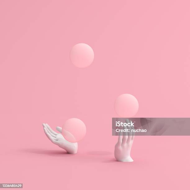3d Rendering Of Juggling Balls With White Hands Sculpture On Pink Background Stock Photo - Download Image Now