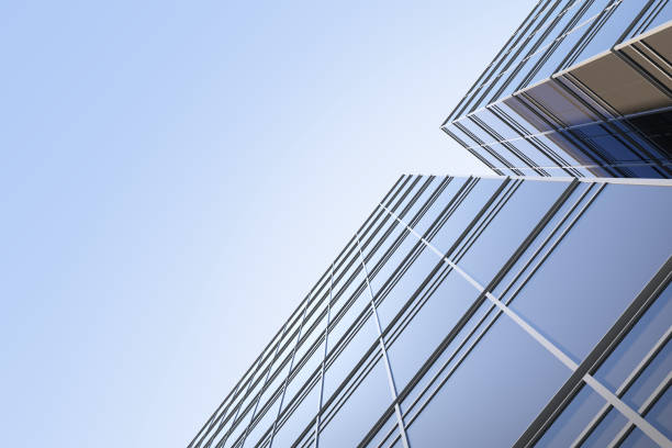 istock Low angle view of futuristic architecture, Skyscraper office building with cloud reflected on window, 3D rendering. 1336485431