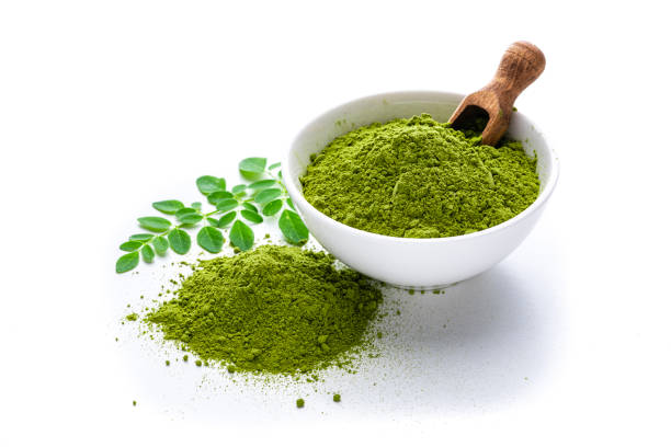 istock Matcha powder and leaves isolated on white background 1336485538