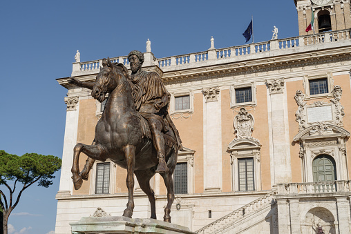 Rome, Italy - June 12, 2021: The modern replica of the statue of the Emperor of Marcus Aurelius in Campidoglio square, Rome. The statue is a copy, made with the use of lasers and other cutting-edge tools, while the original since 1981, is kept inside the Palazzo dei Conservatori