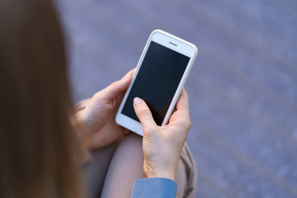 istock Woman hands holding smartphone 1336488365
