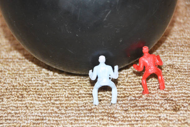 istock Pushing the Bowling Ball 1336492718