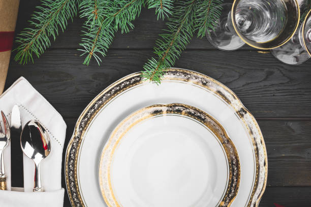 istock Black wooden table with stylish Christmas table setting 1336493780