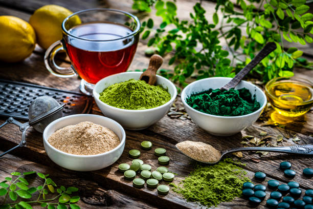 istock Ground Spirulina, Maca and Moringa in white bowls 1336503083