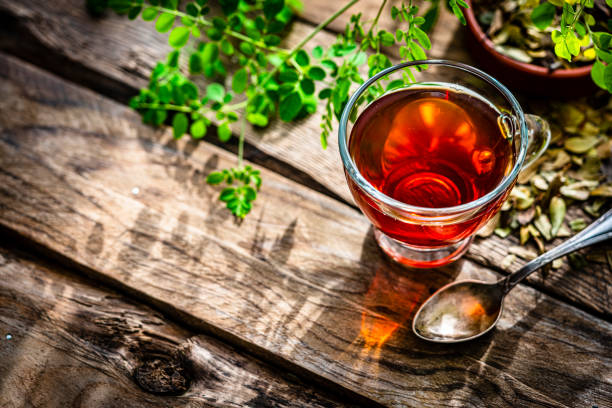 istock Cup of Moringa tea shot on rustic wooden table 1336503126