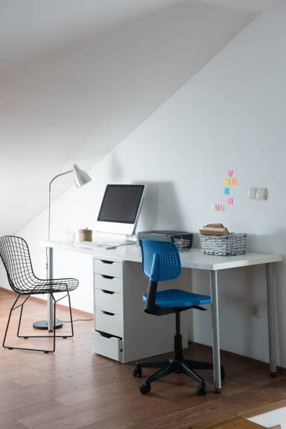 istock modern home interior office working room wooden table in laptop 1336505327