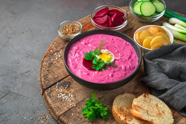 istock Beetroot soup with fresh herbs and egg on a dark brown background with ingredients 1336507301