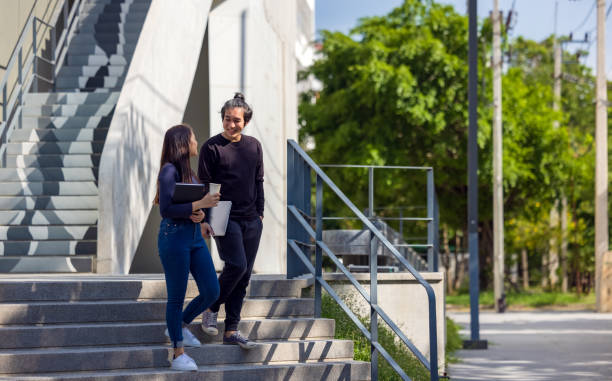 istock Students walk the stairways on campus, a couple walking down into the ground for extra education. 1336507500