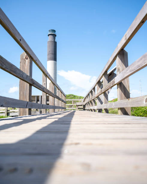 Walkway to the Oak Island Lighthouse The Oak Island, NC lighthouse bald head island stock pictures, royalty-free photos & images